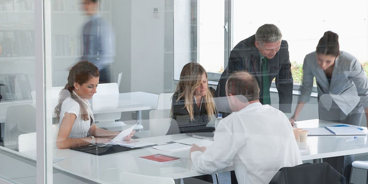 Group of people around boardroom table